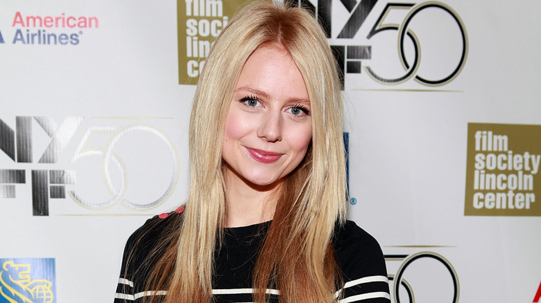 Justine Lupe posing on step-and-repeat
