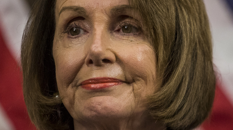 Nancy Pelosi with slight smile