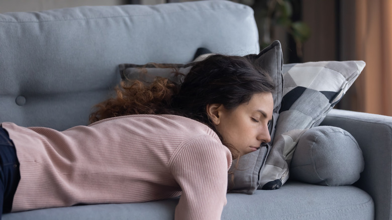 Woman napping on couch 