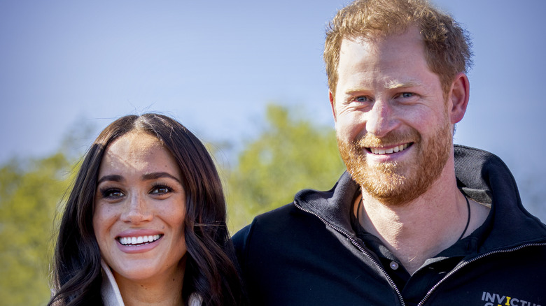 Meghan Markle and Prince Harry smiling at Invictus games