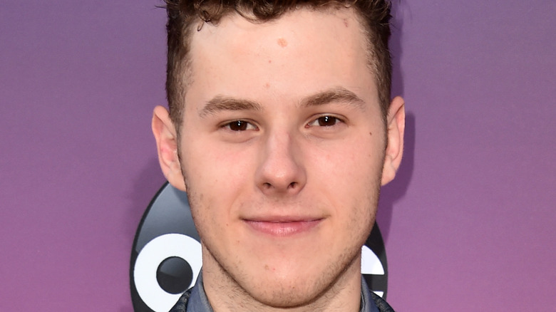 Nolan Gould smiles on the red carpet