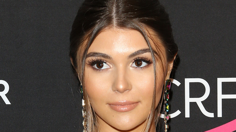 Olivia Jade Giannulli in bold earrings on red carpet