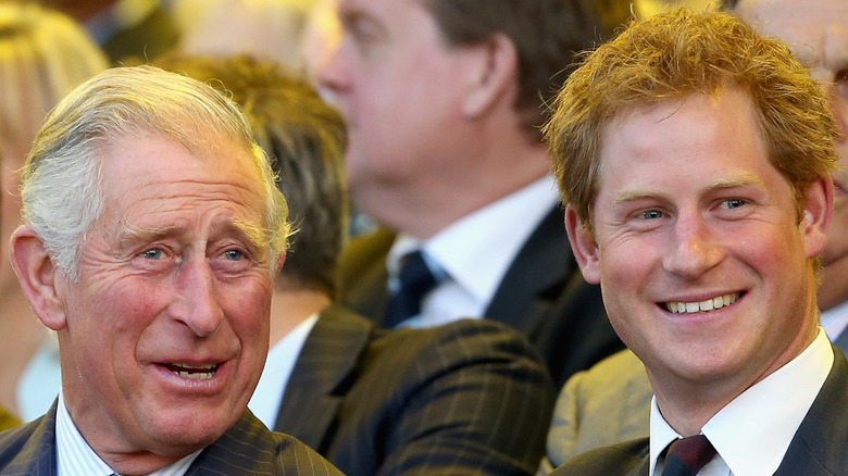 King Charles and Prince Harry share a laugh at an event