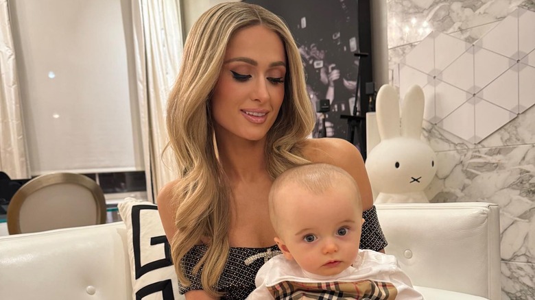 Paris Hilton holding her son