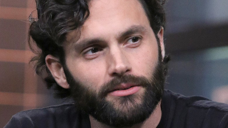 Penn Badgley with a bear