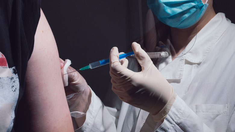 person getting vaccine