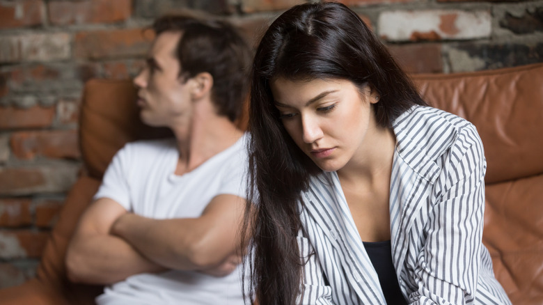 Man and woman in an argument not talking to each other
