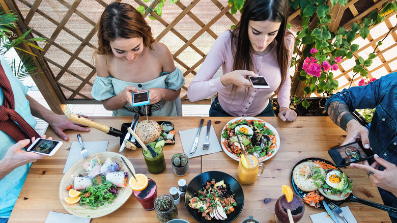 young people taking food photos