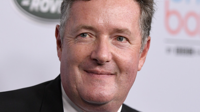 Piers Morgan slightly smiling