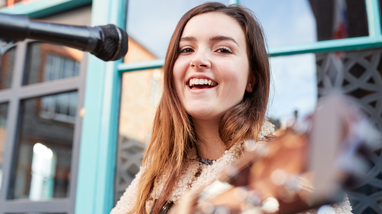 Woman playing the guitar