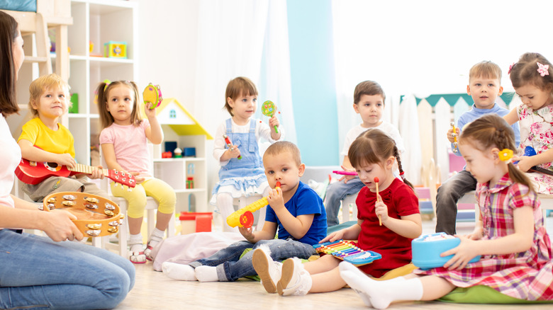 Children learning how to play an instrument