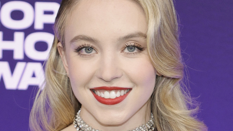 Sydney Sweeney smiling on red carpet