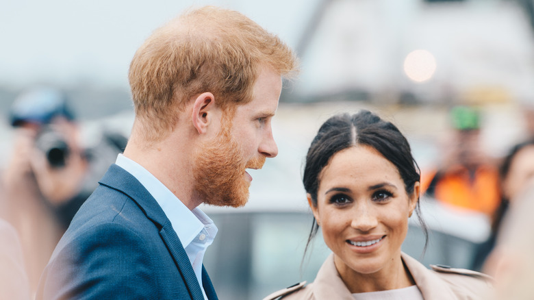 Prince Harry and Meghan Markle smiling