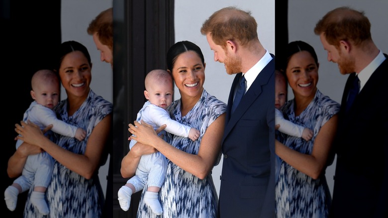 Meghan Markle holding Prince Archie with Prince Harry