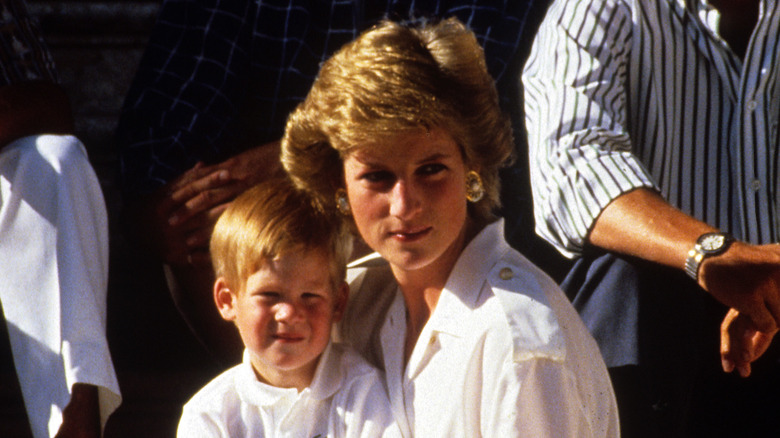 young Prince Harry snuggled close to Princess Diana