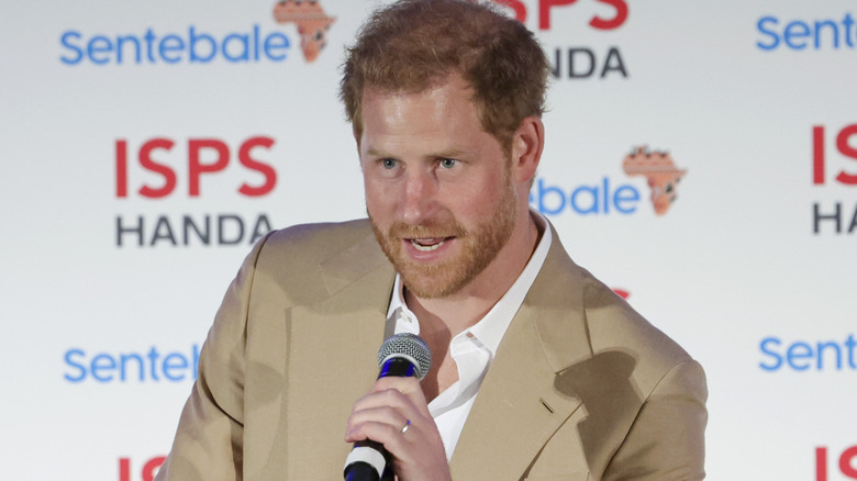 Prince Harry speaking into microphone