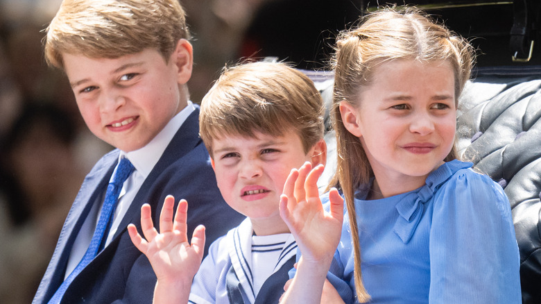 Prince George, Prince Louis, and Princess Charlotte riding in a carriage