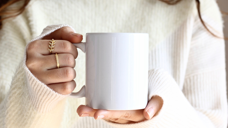 Woman holding coffee mug