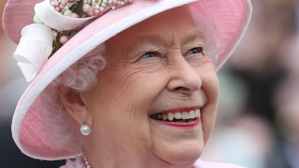 Queen Elizabeth wearing pink hat