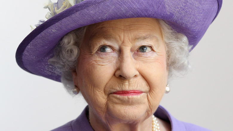 Queen Elizabeth in purple hat