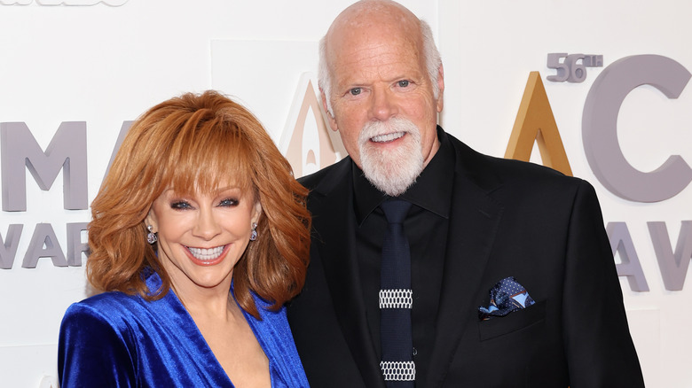 Rex Linn and Reba McEntire on a red carpet