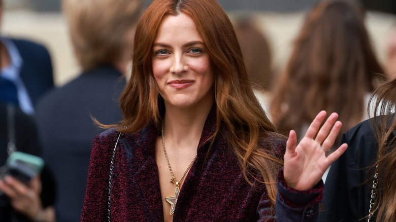 Riley Keough waving