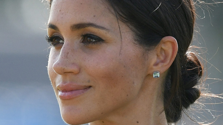 Meghan Markle smiles at an event.