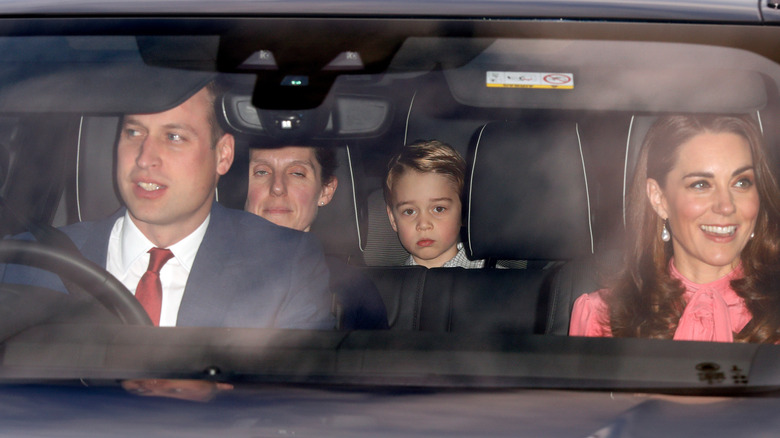 Prince William driving his family in a car