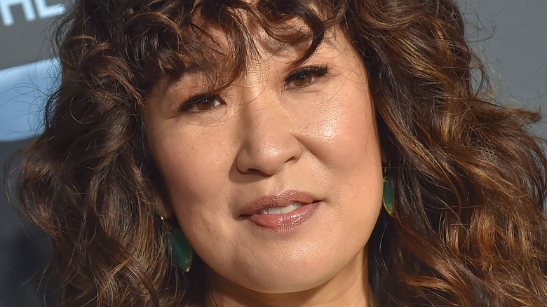 Sandra Oh smiling on the red carpet