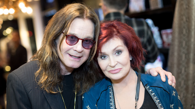 Ozzy Osbourne and Sharon Osbourne posing for photos