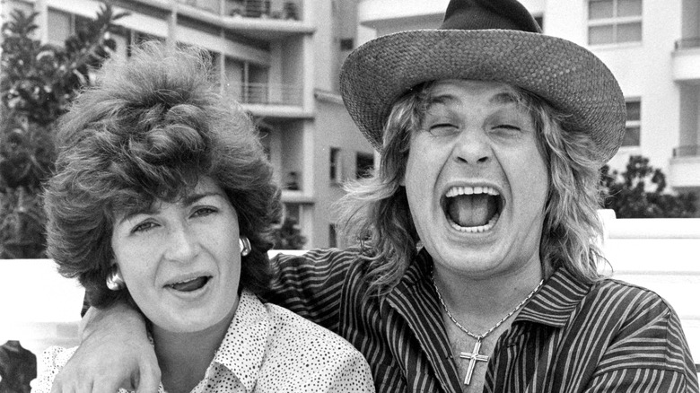 Black-and-white photo of Sharon Osbourne and Ozzy Osbourne having fun together