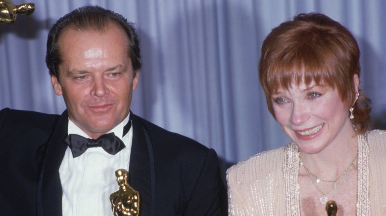 Jack Nicholson and Shirley Maclaine holding their Oscars together