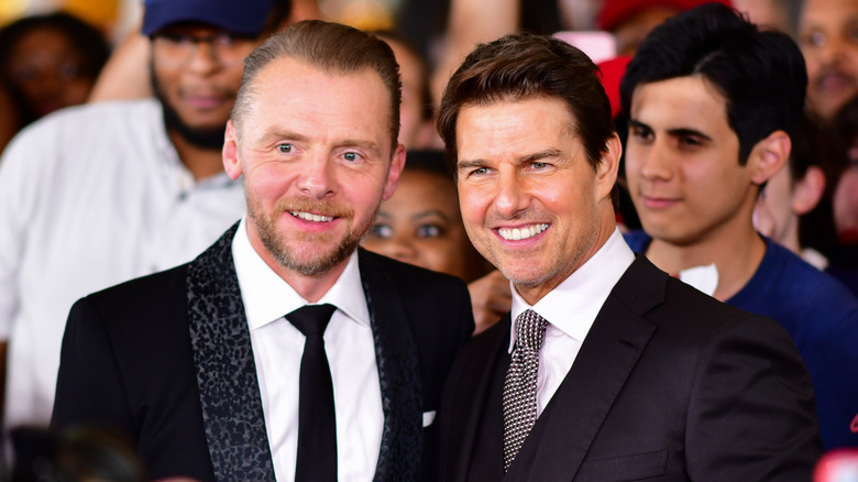 Simon Pegg and Tom Cruise smiling