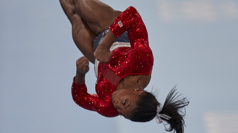 Simone Biles performing mid-air