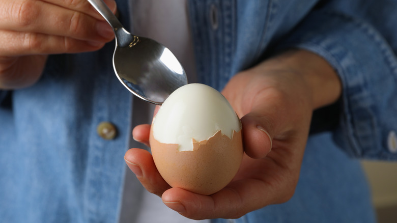 person eating boiled egg