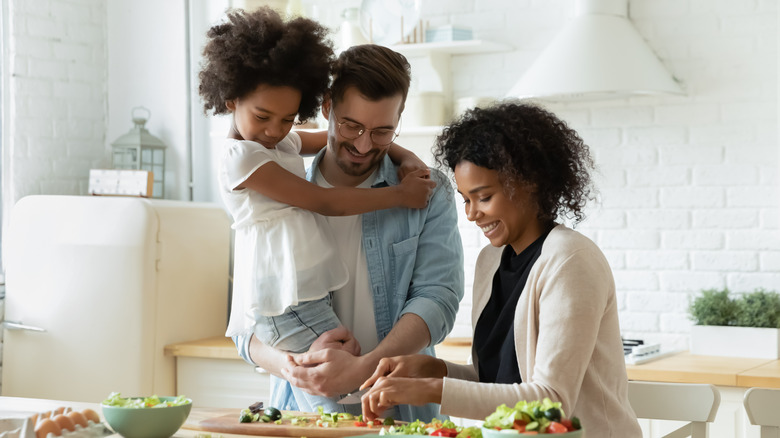 Family cooking together in kitchen