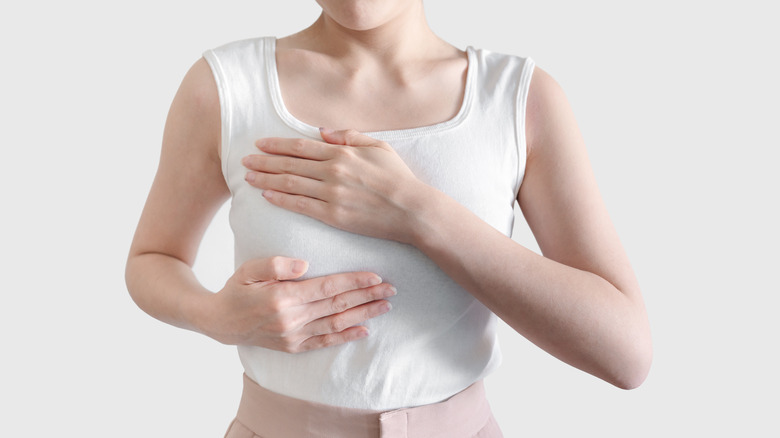 Woman holding breast