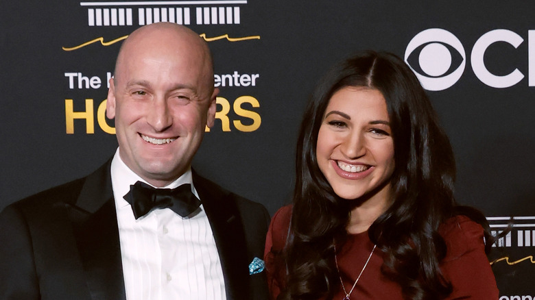 Stephen Miller in a tuxedo and Katie Miller in a maroon dress