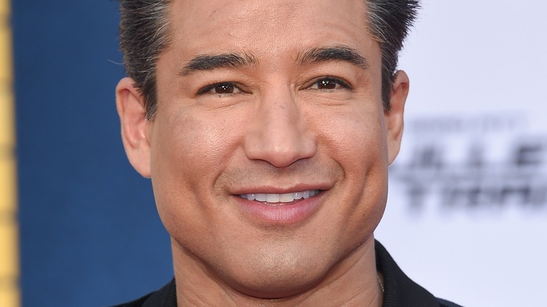 Mario Lopez smiling on the red carpet