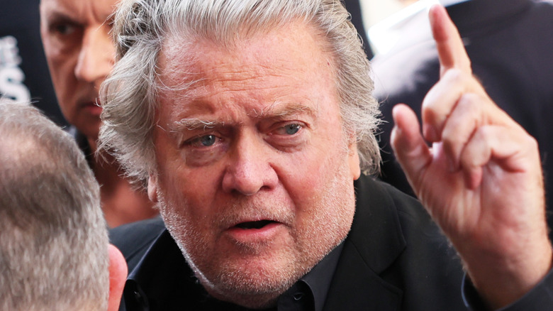 Steven Bannon with index finger raised