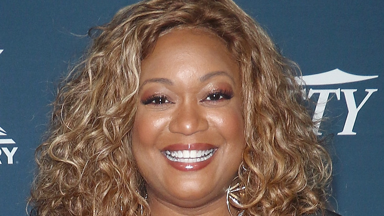 Sunny Anderson smiling on red carpet