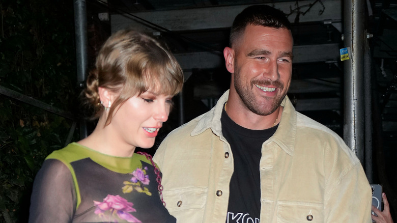 Taylor Swift and Travis Kelce smiling