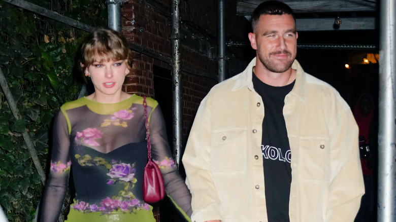 Travis Kelce and Taylor Swift walking together
