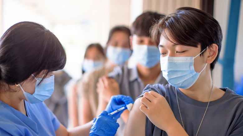 Teenager being vaccinated 