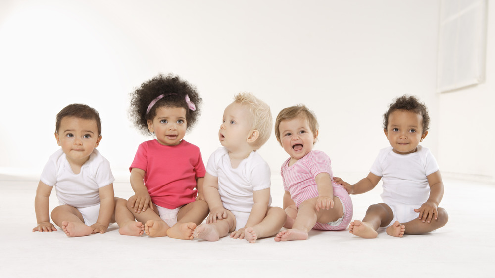 A group of babies sitting up