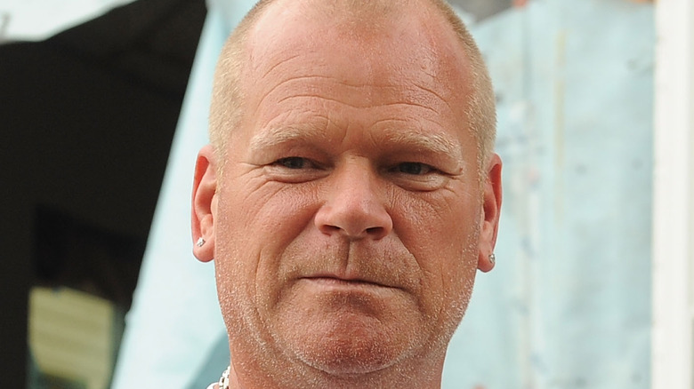 Mike Holmes poses on set 