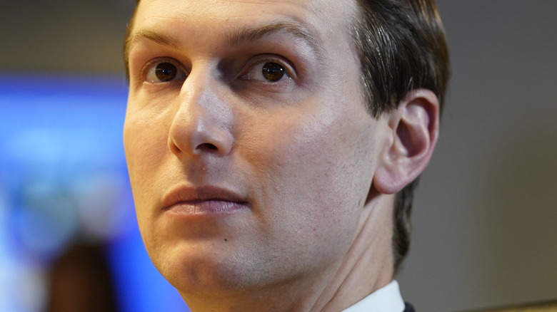 Jared Kushner looking to the side with pensive expression