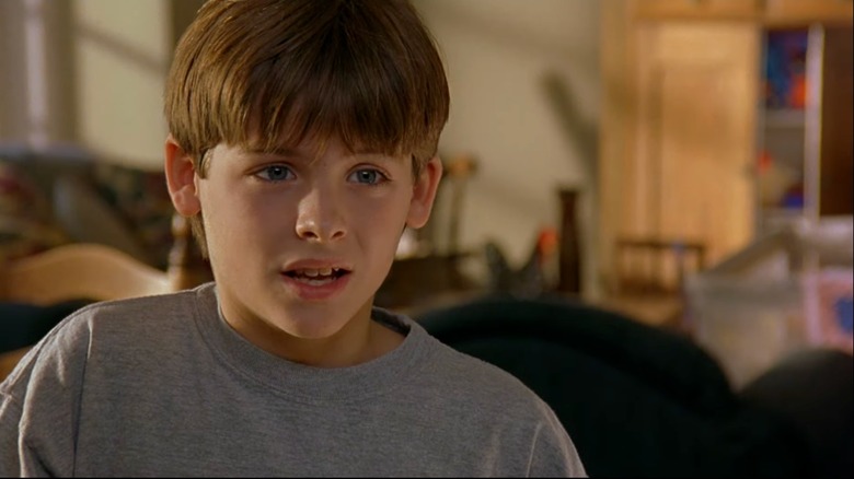 A young Kevin Zegers wearing gray sweatshirt in "Air Bud" (1997)