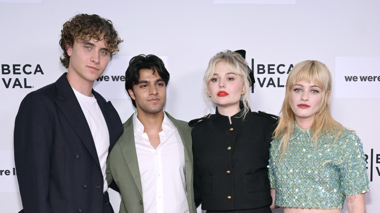 "We Were Liars" stars posing on a film festival red carpet together