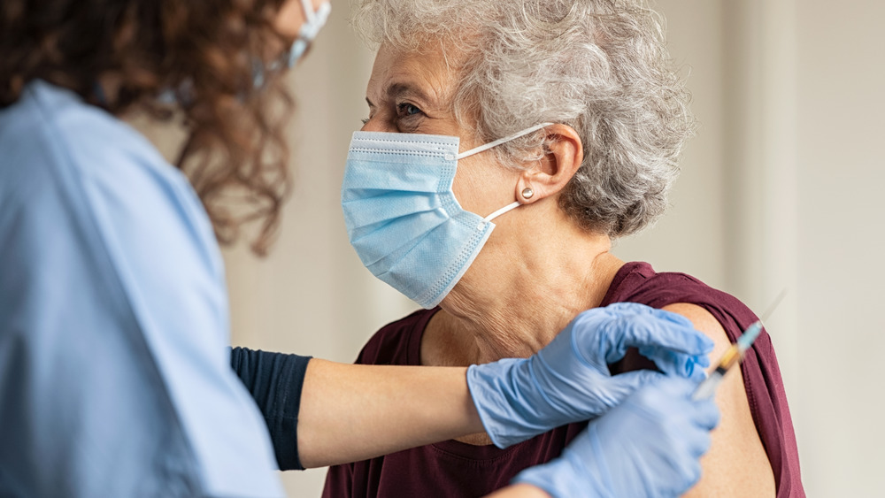 senior getting COVID vaccine